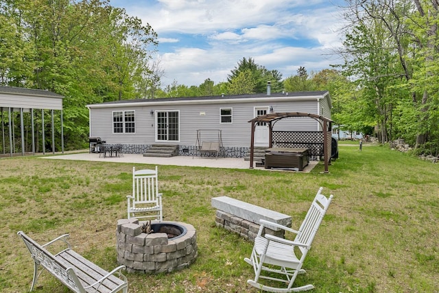 29 Stoneham Rd Unit 4, Wakefield, NH 03872 - rear view of house featuring a hot tub, a fire pit, a patio area, and entry steps