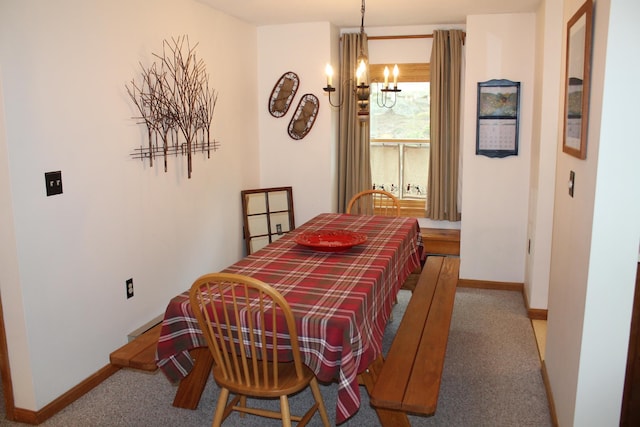 16 Penstock Rd Unit 4, Lincoln, NH 03251 - dining room featuring a chandelier, baseboards, and carpet floors