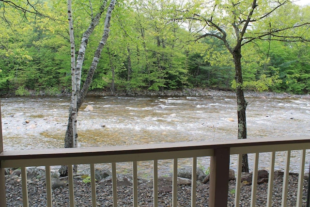 16 Penstock Rd Unit 4, Lincoln, NH 03251 - water view featuring a heavily wooded area