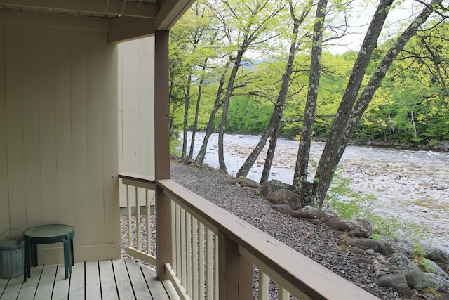 16 Penstock Rd Unit 4, Lincoln, NH 03251 - wooden terrace with a water view and a forest view