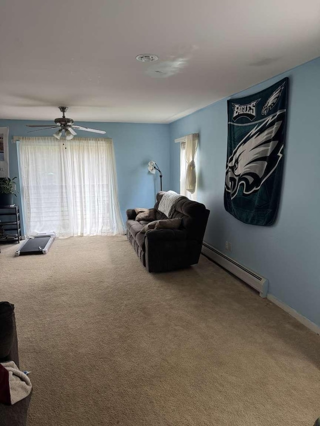 87 Juniper Dr, South Burlington, VT 05403 - living area featuring carpet, baseboard heating, ceiling fan, and baseboards