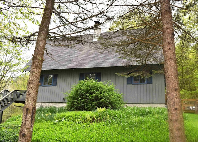 191 Highland Rd, Wallingford, VT 05773 - view of home's exterior with a shingled roof and a chimney