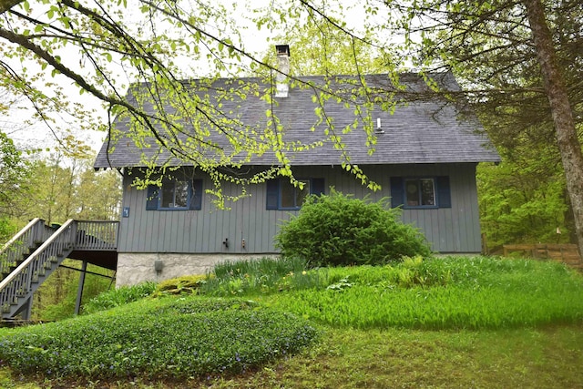 191 Highland Rd, Wallingford, VT 05773 - view of side of property with stairs, a chimney, a shingled roof, and a deck