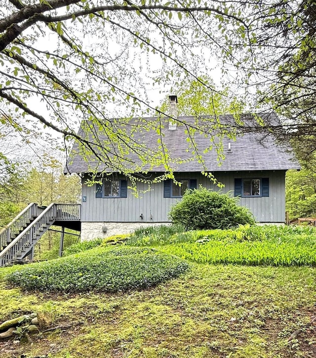 191 Highland Rd, Wallingford, VT 05773 - back of house with stairway, a chimney, a shingled roof, and board and batten siding