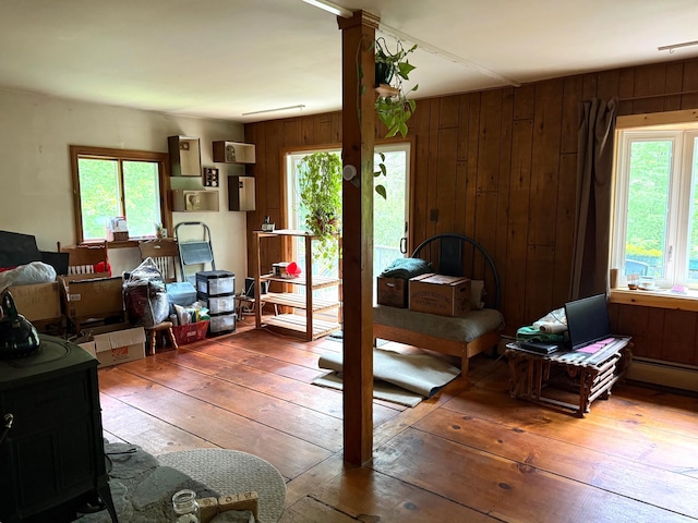 191 Highland Rd, Wallingford, VT 05773 - bedroom with hardwood / wood-style flooring, multiple windows, and wood walls