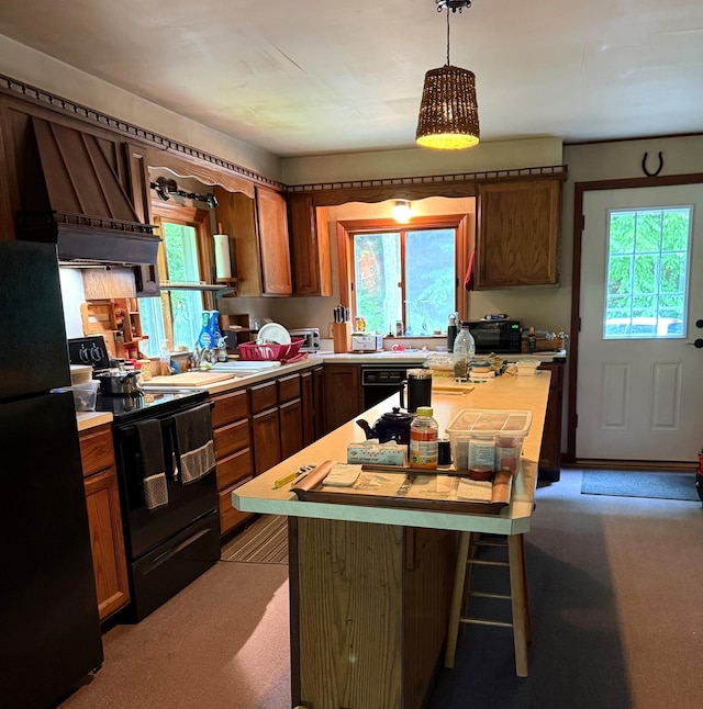 191 Highland Rd, Wallingford, VT 05773 - kitchen featuring black appliances, light countertops, plenty of natural light, and carpet floors