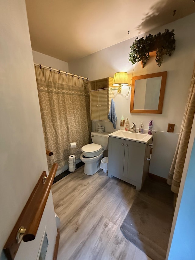 191 Highland Rd, Wallingford, VT 05773 - bathroom with vanity, wood finished floors, and a shower with curtain