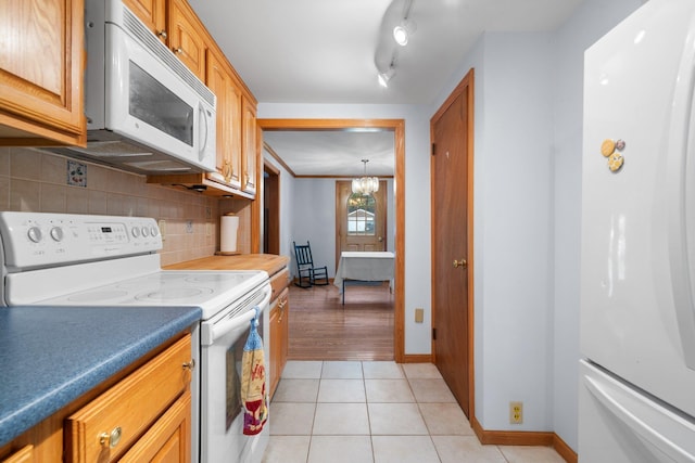 28 Joslin Rd, Swanzey, NH 03431 - kitchen featuring white appliances, tasteful backsplash, baseboards, and light tile patterned floors