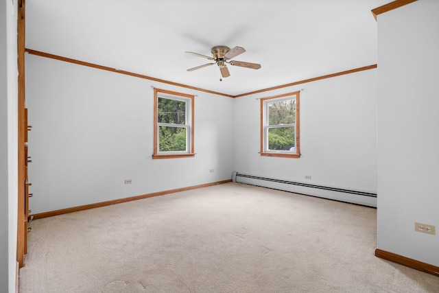 28 Joslin Rd, Swanzey, NH 03431 - carpeted spare room featuring a baseboard radiator, healthy amount of natural light, a ceiling fan, baseboards, and crown molding