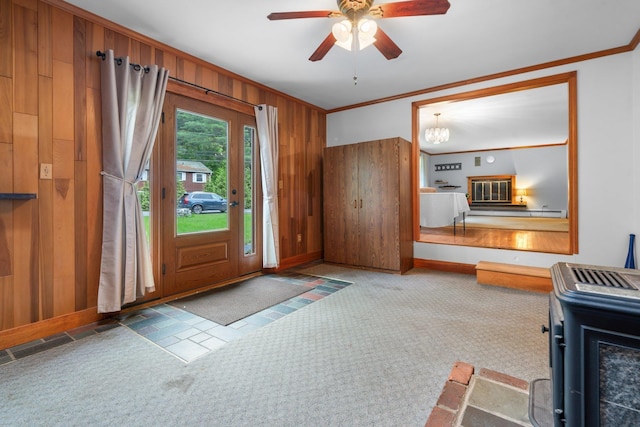 28 Joslin Rd, Swanzey, NH 03431 - carpeted entrance foyer with ornamental molding, wooden walls, baseboards, and a ceiling fan