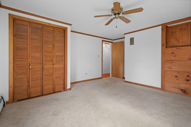 28 Joslin Rd, Swanzey, NH 03431 - unfurnished bedroom featuring carpet flooring, crown molding, baseboards, a ceiling fan, and a closet