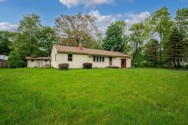 28 Joslin Rd, Swanzey, NH 03431 - rear view of house featuring a yard and a chimney