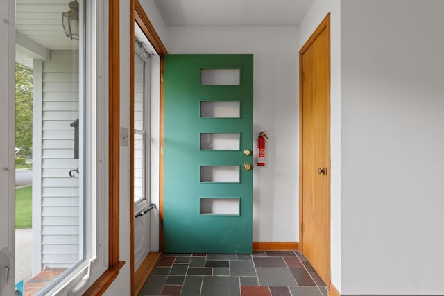 33 Wildwood Dr, Burlington, VT 05408 - entryway with dark stone finish flooring and baseboards