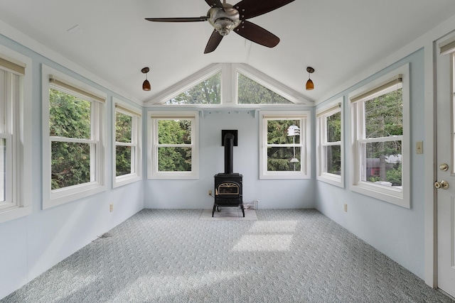 33 Wildwood Dr, Burlington, VT 05408 - unfurnished sunroom featuring a wood stove, healthy amount of natural light, lofted ceiling, and carpet