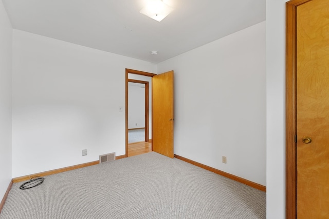 33 Wildwood Dr, Burlington, VT 05408 - carpeted spare room featuring baseboards and a smoke detector