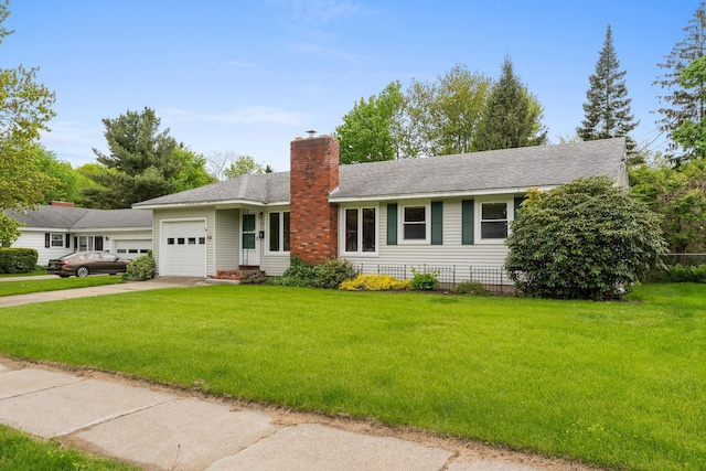 33 Wildwood Dr, Burlington, VT 05408 - single story home with an attached garage, driveway, a front lawn, and a chimney
