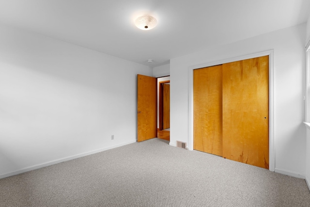 33 Wildwood Dr, Burlington, VT 05408 - unfurnished bedroom with carpet, a closet, and baseboards