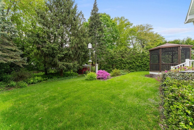 33 Wildwood Dr, Burlington, VT 05408 - view of grassy yard featuring a gazebo and a sunroom