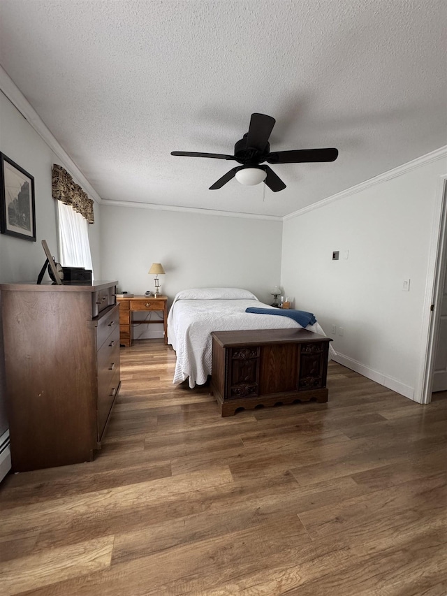 11 Modena Dr Unit 11, Concord, NH 03303 - bedroom featuring wood finished floors, crown molding, a textured ceiling, ceiling fan, and baseboards