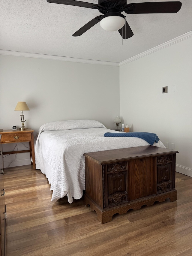 11 Modena Dr Unit 11, Concord, NH 03303 - bedroom with crown molding, wood finished floors, baseboards, and ceiling fan