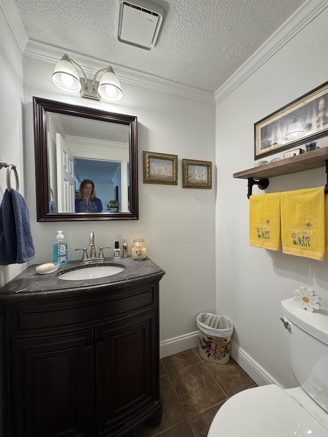 11 Modena Dr Unit 11, Concord, NH 03303 - bathroom featuring toilet, vanity, crown molding, a textured ceiling, and tile patterned flooring