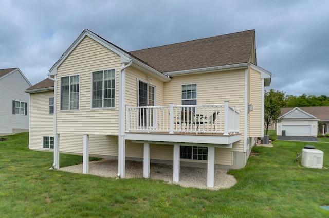 17 Misty Meadow Rd Unit 17, Windham, NH 03087 - back of property with a lawn, a shingled roof, central air condition unit, and a deck