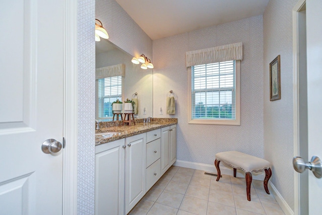 17 Misty Meadow Rd Unit 17, Windham, NH 03087 - full bathroom with healthy amount of natural light, double vanity, tile patterned floors, baseboards, and wallpapered walls