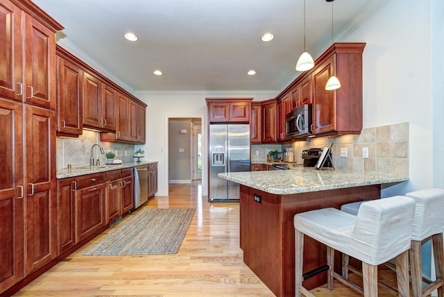 17 Misty Meadow Rd Unit 17, Windham, NH 03087 - kitchen featuring appliances with stainless steel finishes, ornamental molding, a peninsula, backsplash, and decorative light fixtures