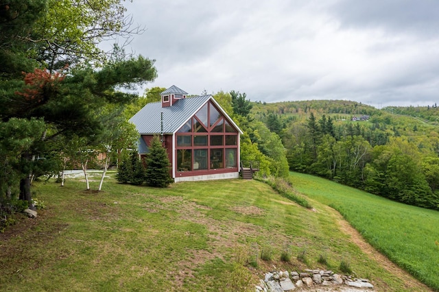 938 Stigers Rd, Andover, VT 05143 - view of green lawn featuring a wooded view and a sunroom