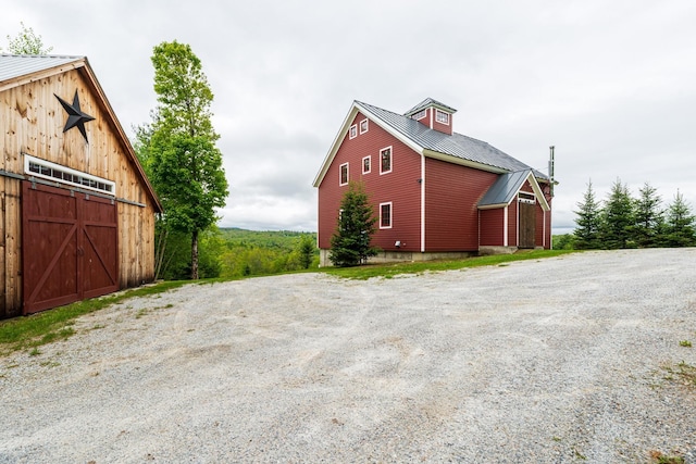 938 Stigers Rd, Andover, VT 05143 - view of side of property with a barn, metal roof, an outdoor structure, and a garage