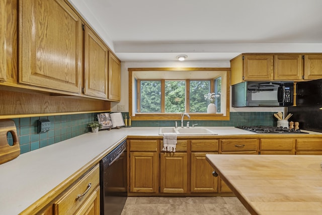 3 Timber Ln, Merrimack, NH 03054 - kitchen featuring black appliances, light countertops, tasteful backsplash, and a sink