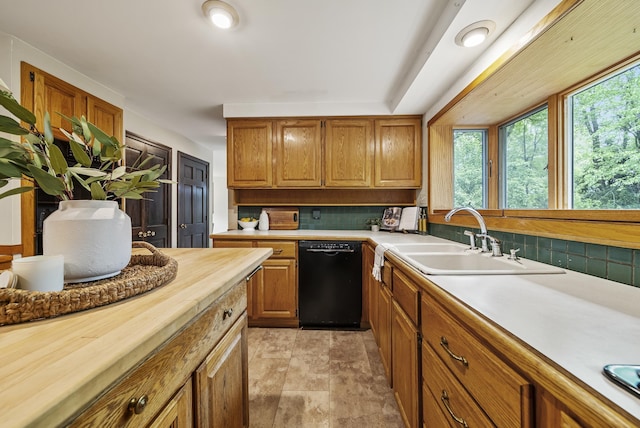3 Timber Ln, Merrimack, NH 03054 - kitchen featuring black dishwasher, backsplash, plenty of natural light, and a sink