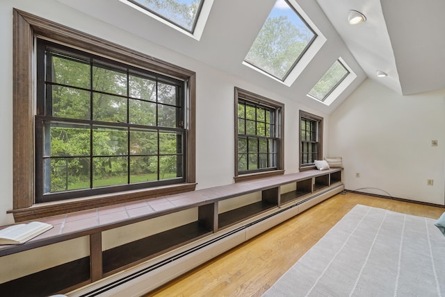 3 Timber Ln, Merrimack, NH 03054 - interior space featuring a skylight, baseboard heating, and lofted ceiling