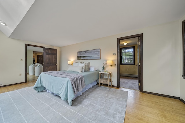3 Timber Ln, Merrimack, NH 03054 - bedroom with a baseboard radiator, light wood-style flooring, and baseboards