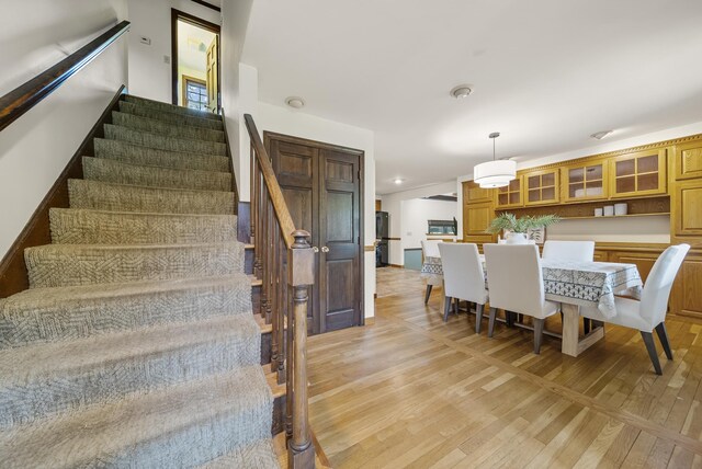 3 Timber Ln, Merrimack, NH 03054 - dining room featuring stairway and light wood-style flooring