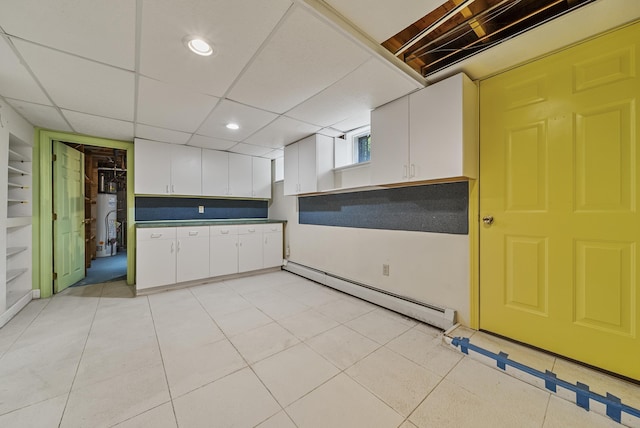 3 Timber Ln, Merrimack, NH 03054 - kitchen with a baseboard radiator, white cabinets, gas water heater, recessed lighting, and dark countertops