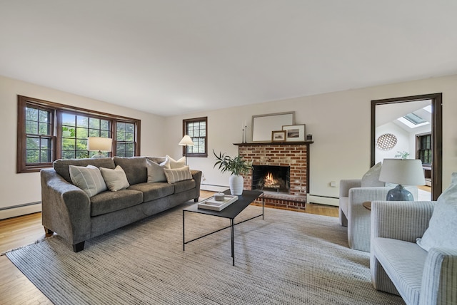 3 Timber Ln, Merrimack, NH 03054 - living room with wood finished floors, a baseboard radiator, baseboard heating, and a fireplace