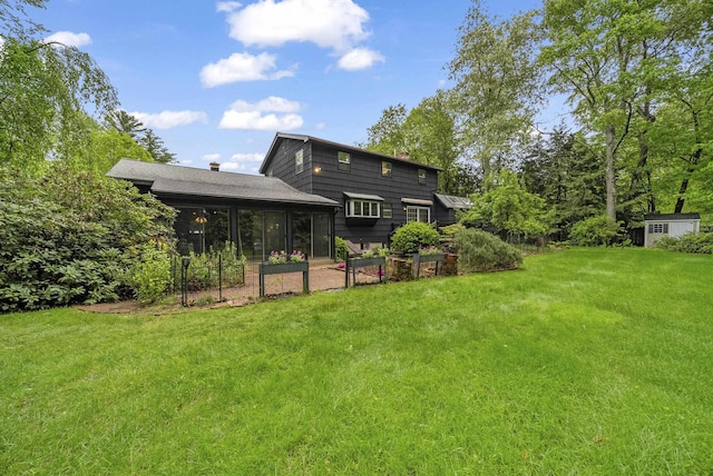 3 Timber Ln, Merrimack, NH 03054 - back of property featuring a sunroom, a yard, and a chimney