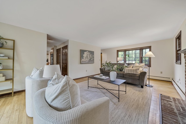 3 Timber Ln, Merrimack, NH 03054 - living room featuring a baseboard radiator, light wood-style floors, and baseboards