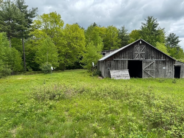 149 John Hodgdon Rd, Ossipee, NH 03864 - view of barn featuring a view of trees