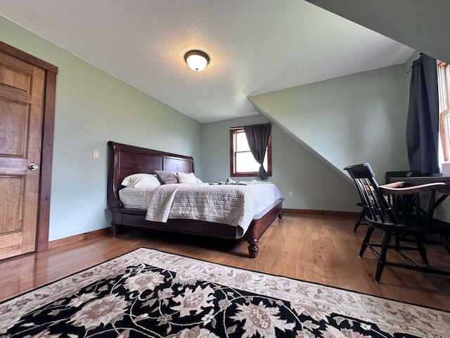 2522 Number 12 Rd, Newport City, VT 05857 - bedroom featuring lofted ceiling, wood finished floors, baseboards, and a textured ceiling