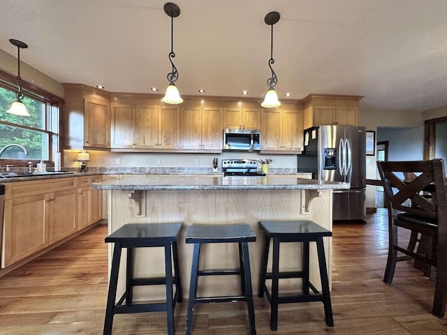 2522 Number 12 Rd, Newport City, VT 05857 - kitchen featuring appliances with stainless steel finishes, a sink, dark wood-style flooring, a center island, and recessed lighting