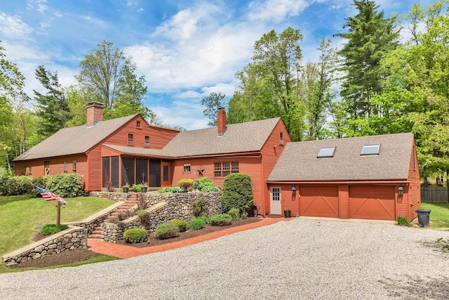 74 Bartlett Rd, Barnstead, NH 03225 - view of front of house with a chimney, a sunroom, a shingled roof, an attached garage, and gravel driveway
