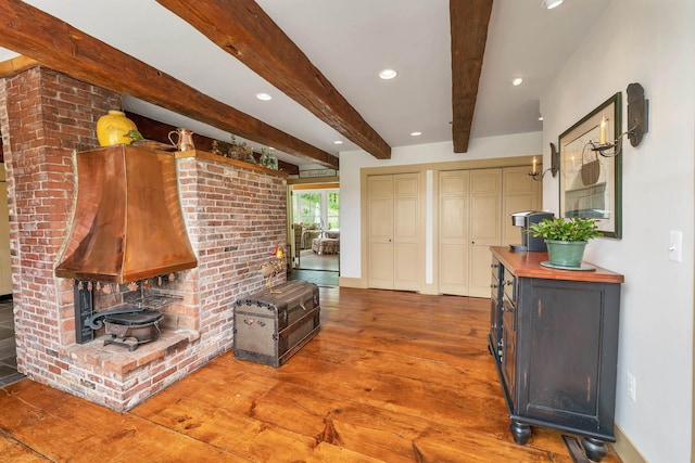 74 Bartlett Rd, Barnstead, NH 03225 - living area featuring a wood stove, wood finished floors, beamed ceiling, and recessed lighting