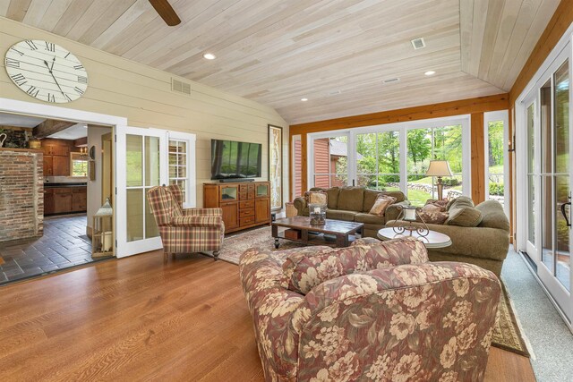 74 Bartlett Rd, Barnstead, NH 03225 - living room with wood ceiling, wood walls, a ceiling fan, wood finished floors, and lofted ceiling