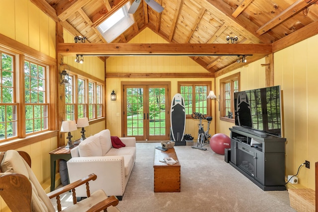 74 Bartlett Rd, Barnstead, NH 03225 - living area featuring wood ceiling, wood walls, plenty of natural light, a ceiling fan, and carpet floors