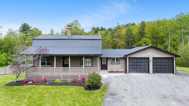 753 Sanborn Rd, Sanbornton, NH 03269 - view of front of home featuring a porch, an attached garage, asphalt driveway, and a front lawn
