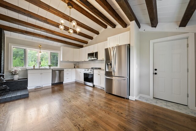 753 Sanborn Rd, Sanbornton, NH 03269 - kitchen featuring stainless steel appliances, a chandelier, white cabinets, wood finished floors, and a sink