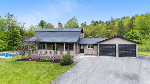 753 Sanborn Rd, Sanbornton, NH 03269 - view of front of home featuring a porch, a chimney, a front yard, and metal roof