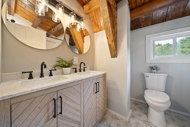 753 Sanborn Rd, Sanbornton, NH 03269 - full bathroom with double vanity, wooden ceiling with exposed beams, toilet, and baseboards